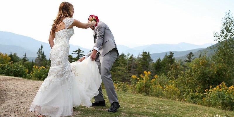 Bride hitting groom with flower bouquet