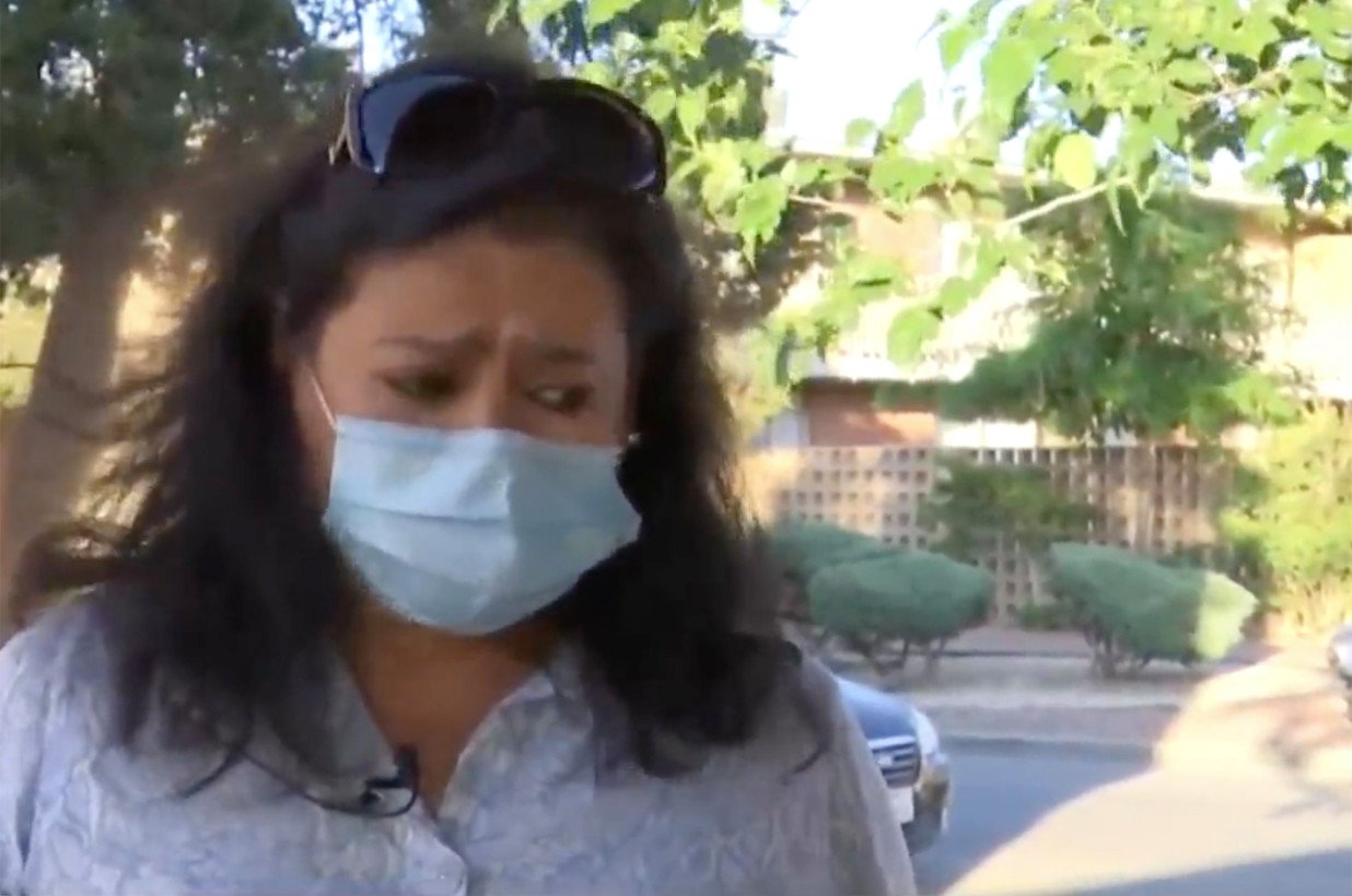 a masked Ana Cardenas speaking about her ordeal to local media