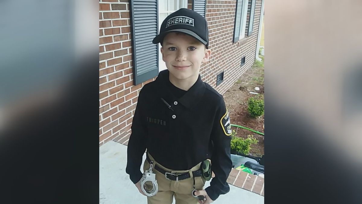 North Carolina second-grader Daniel Thigpen proudly wearing his sheriff's deputy outfit