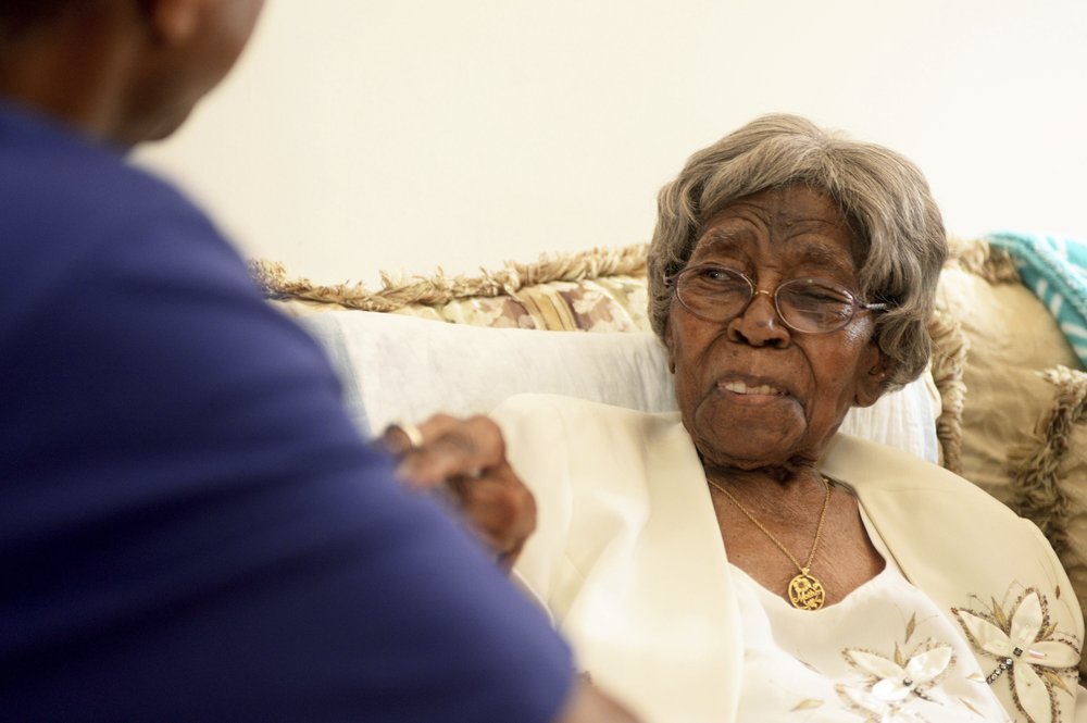 Roosevelt Patterson greeting his remarkable grandmother Hester Ford at her 111th birthday party