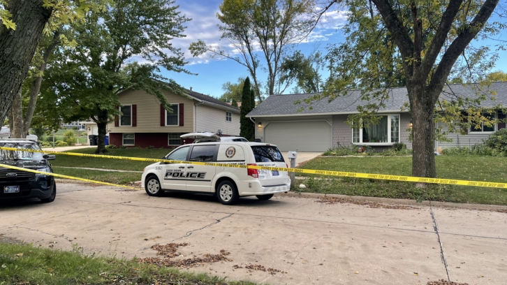 police vehicle outside taped-off home