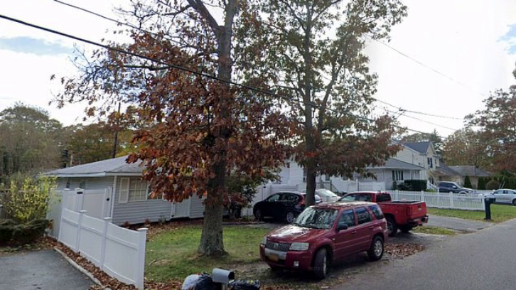 The home in the Long Island hamlet of Shirley, where police responding Saturday to a report of a fire discovered a burning body