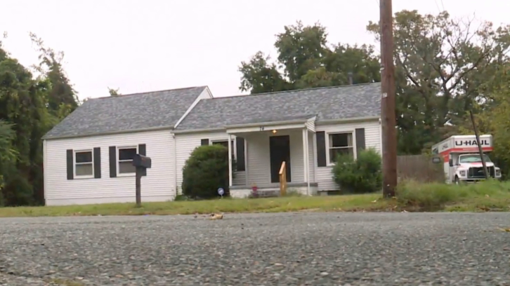 single-storey home with U-Haul truck parked beside