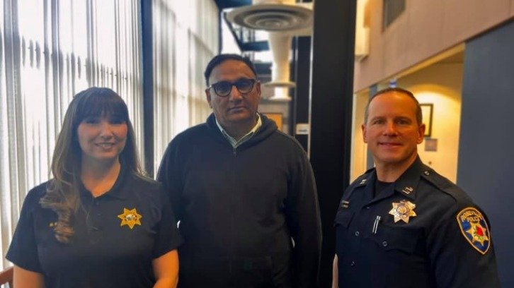 Taxi driver Raj Singh, who saved 92-year-old woman from $25,000 tax scam, pictured with Roseville police officers