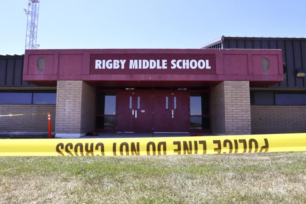 Police tape marking a line outside Rigby Middle School