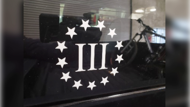 Insignia on Rogers' vehicle for the "Three-Percenters," an anti-government militia group