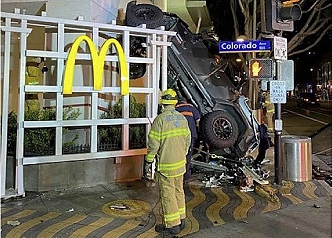 The scene after a car drove off the roof of a parking garage