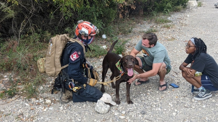 Stout the dog and rescuers