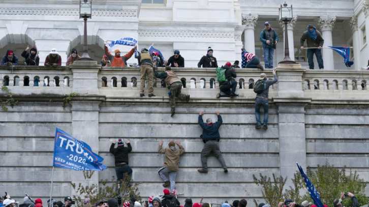 Trump supporters climbing the west wall of the U.S. Capitol on Wednesday, Jan. 6, 2021