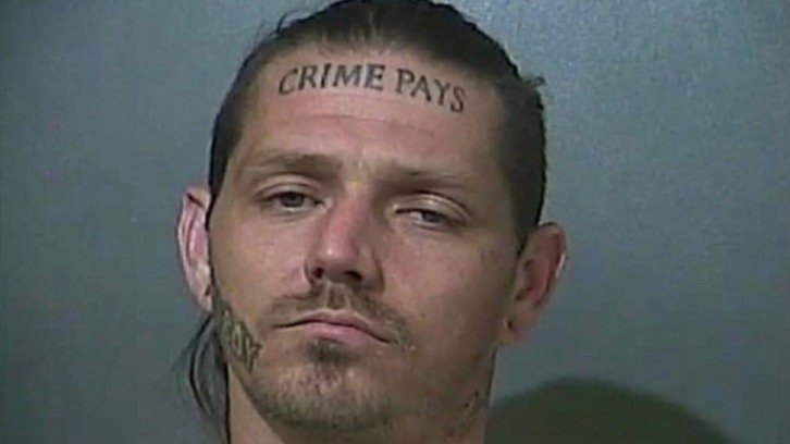 Police mugshot of Donald Murray of Terre Haute, Indiana, who has the words "CRIME PAYS" tattooed on his forehead