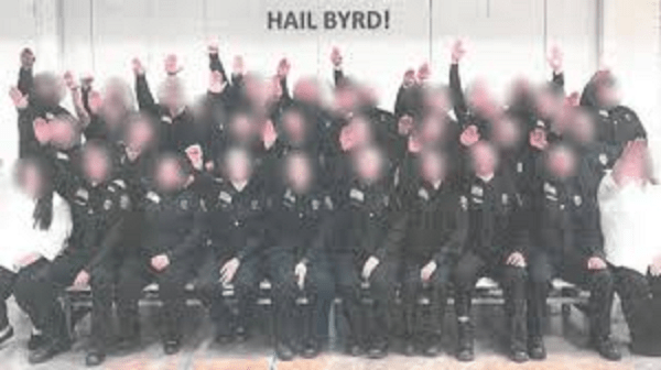 West Virginia prison officer cadets with blurred faces performing a Nazi salute